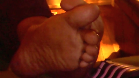 Ebony chick with a sexy body sucks and shoves her foot in her pussy