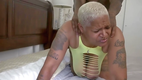 Blonde milf with a tattoo on her belly gets fucked