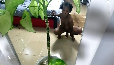 Busty ebony fucks in a solo session with a big black dildo