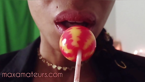 Ebony MILF sucks lollipop while her lover is with her