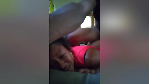 Ebony babe spreads her pussy while stretching a dick