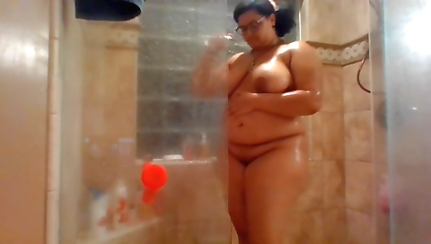 Ebony amateur milf gets naked for a shower and plays