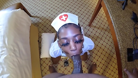 Ebony nurse with large white cock gets her mouth to work
