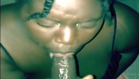 Busty black bitch with big boobs sucking and licking big cock