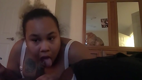 Busty ebony babe sucks a big black cock and smokes
