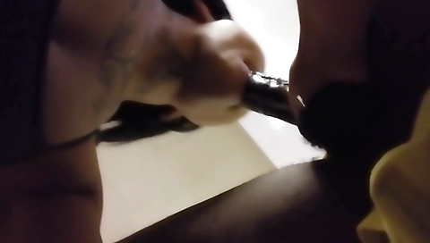 Ebony beauty gives a blowjob to a long haired black dude