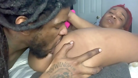 Ebony woman is eating her pussy and sucking on a dildo